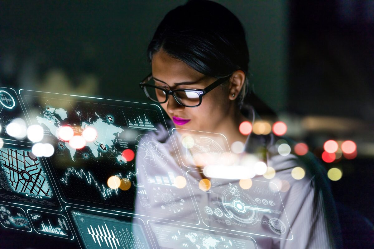 Businesswoman,looking,at,futuristic,interface,screen.