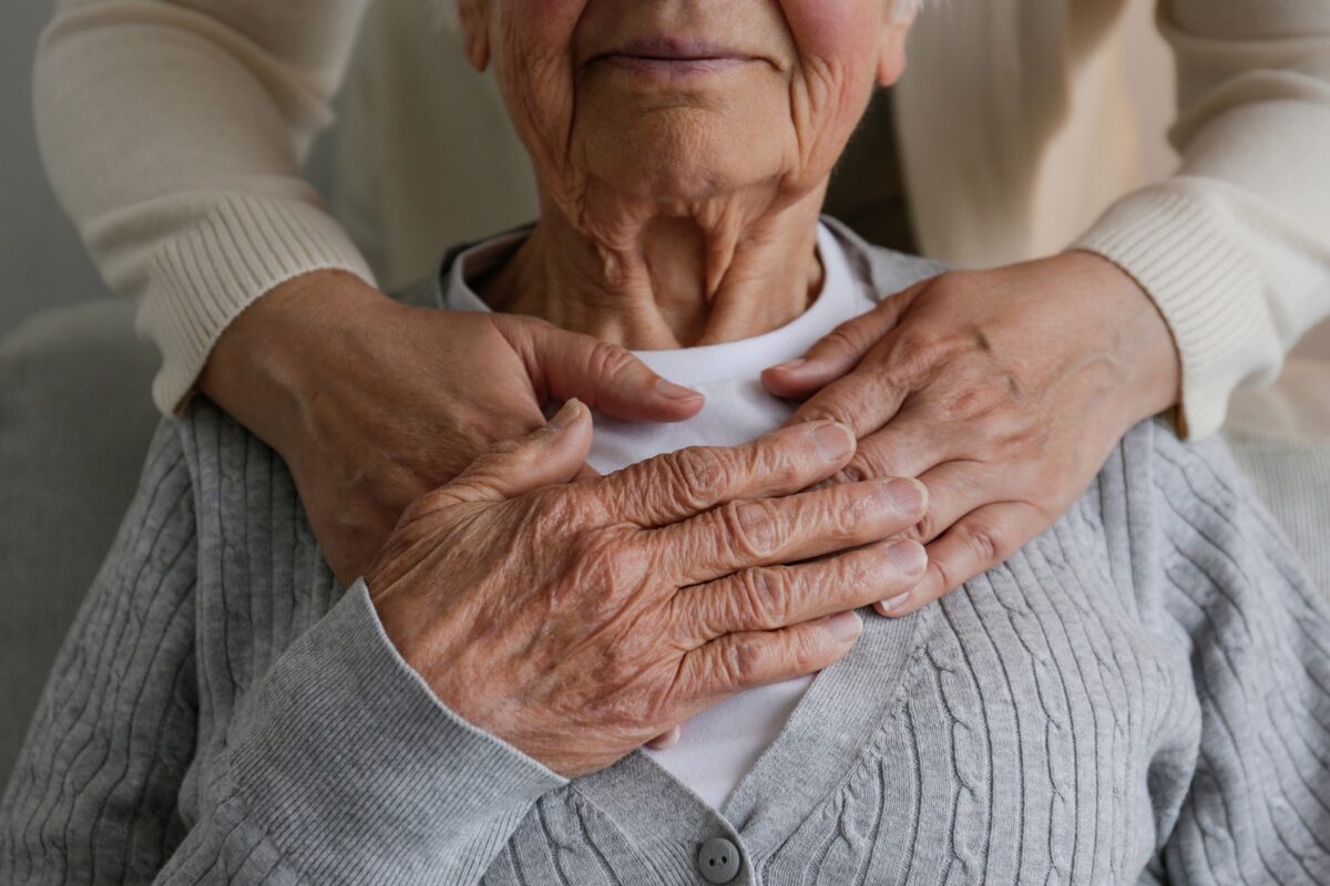 Unrecognizable,female,expressing,care,towards,an,elderly,lady,,hugging,her