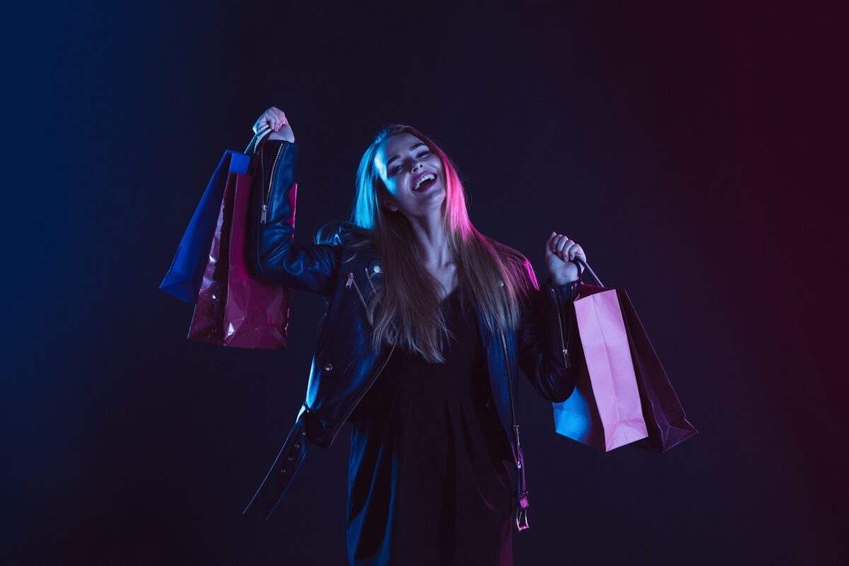 Portrait,of,young,woman,in,neon,light,on,dark,backgound