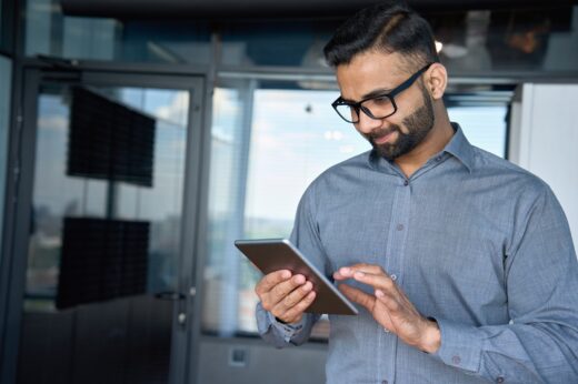 Young,indian,marketing,business,manager,expert,in,glasses,standing,in