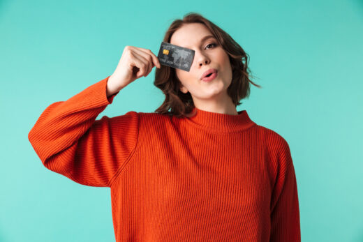 Portrait,of,a,pretty,young,woman,dressed,in,sweater,holding