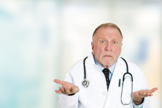 Closeup,portrait,clueless,senior,health,care,professional,doctor,with,stethoscope,