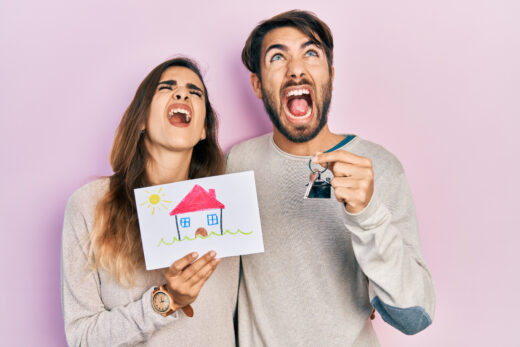 Young,hispanic,couple,holding,house,draw,and,key,of,new