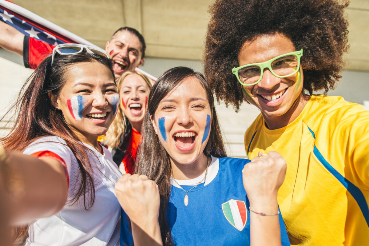 Group,of,sport,supporters,at,stadium,taking,selfie, ,fans