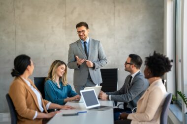 Successful,multiethnic,business,people,presenting,analytical,report,while,working,together