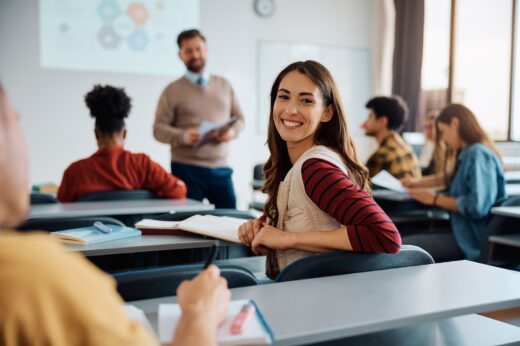 Happy,college,student,during,a,lecture,in,the,classroom,looking