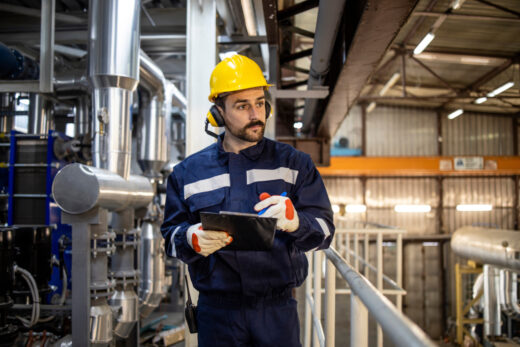 Night,shift,worker,foreman,walking,through,heating,plant,and,controlling