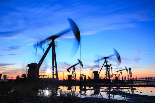 Oil,field,site,,in,the,evening,,oil,pumps,are,running,