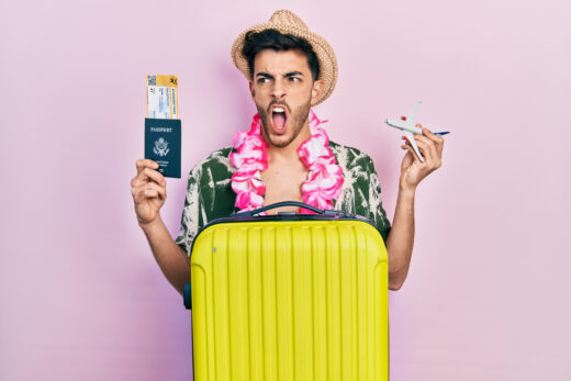 Young,hispanic,man,wearing,summer,style,and,hawaiian,lei,holding