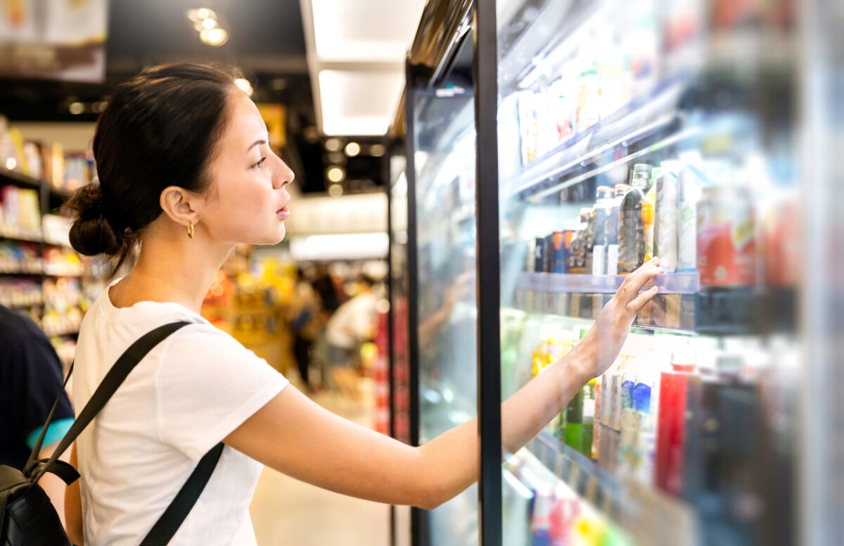 Portrait,of,caucasian,woman,looking,at,product,at,grocery,store.