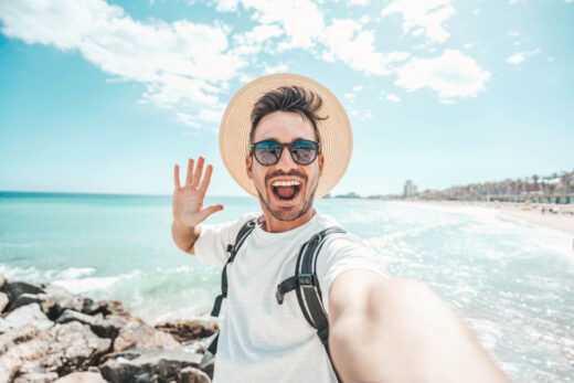 Handsome,young,man,taking,selfie,at,beach,summer,vacation,