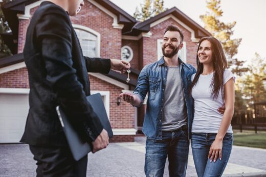 Happy,couple,is,taking,keys,from,their,new,house,from