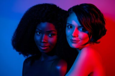 Portrait,of,two,attractive,naked,nude,women,embracing,enjoying,life