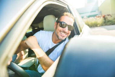 A,portrait,of,man,on,car,having,fun