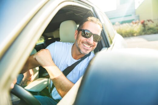 A,portrait,of,man,on,car,having,fun