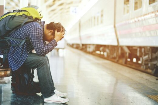 The,tourist,backpack,man,arrived,late,at,the,station.,depressed