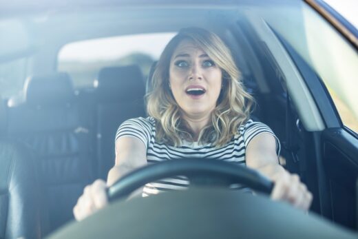 The,woman,driving,the,car,in,a,panic.,the,lady