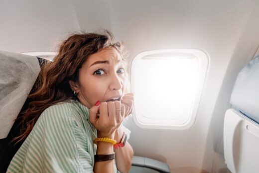 Woman,with,aerophobia,is,afraid,to,fly,on,an,airplane