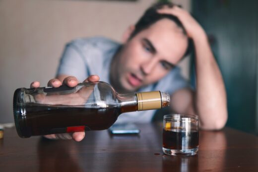 Sad,sad,young,alcoholic,sit,at,the,table,with,a