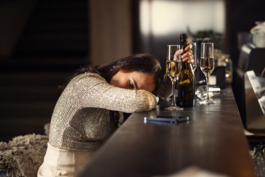 A,drunk,woman,in,a,bar,has,fallen,asleep,on